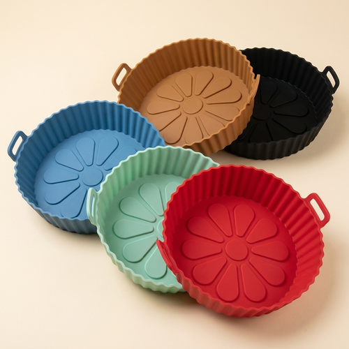 CrispNest reusable silicone air fryer liners in all five colors: red, green, blue, brown, and black